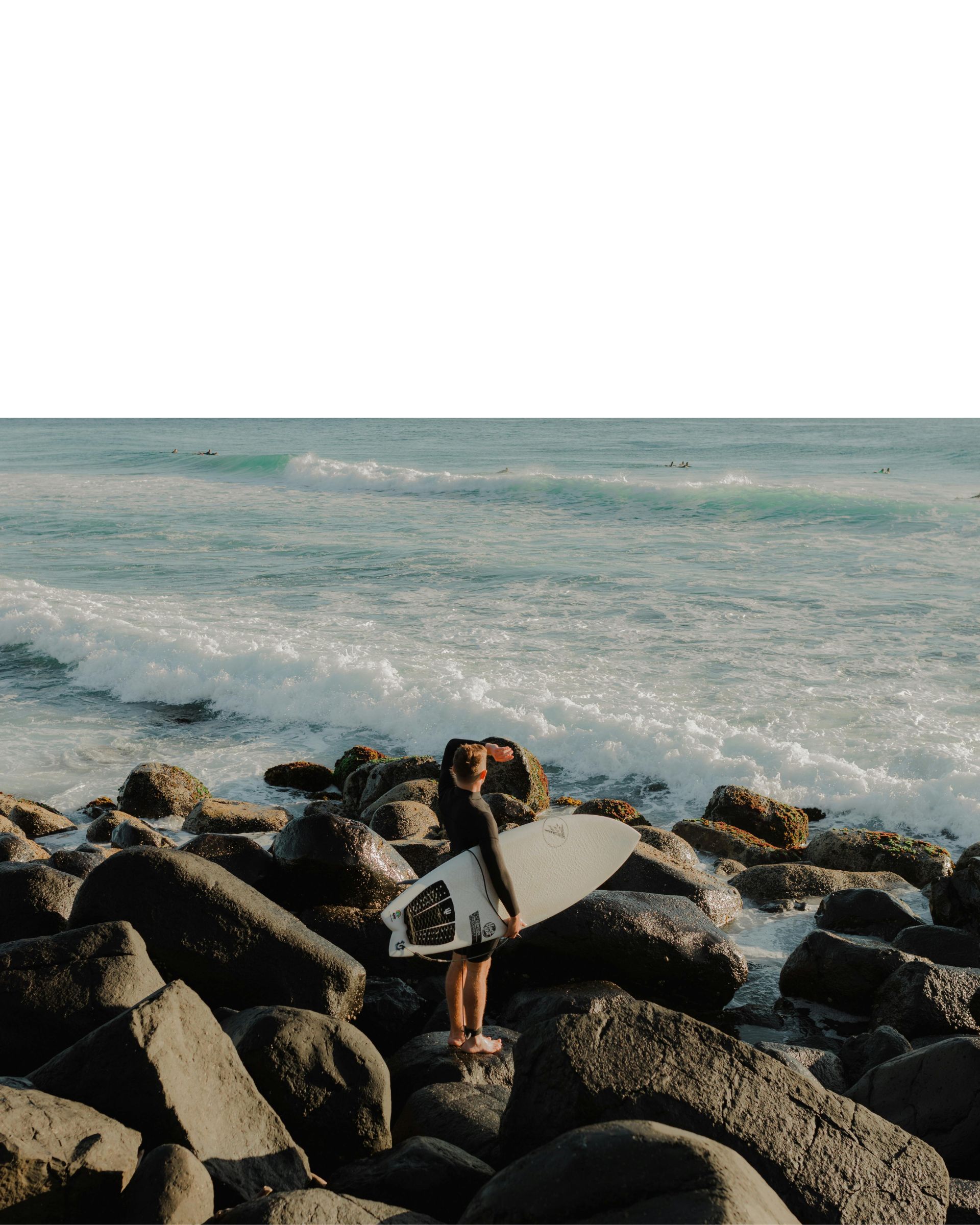 Waves breaking beside a rocky shoreline